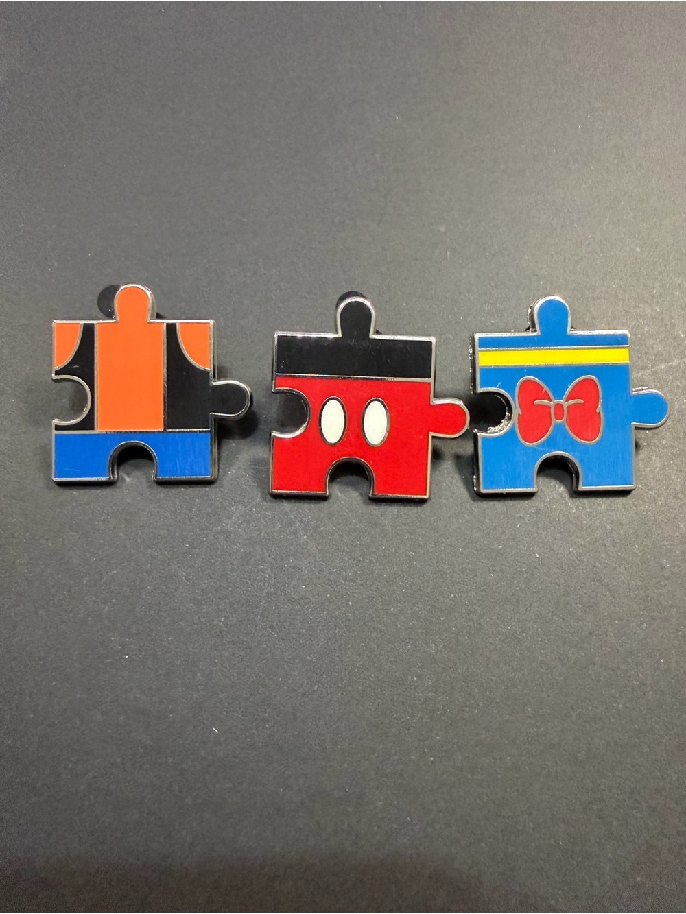 Disney Enamel Puzzle Piece Pin Trio - Red, Blue & Orange